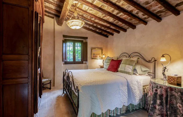 Guest House Queen Bedroom with garden views.