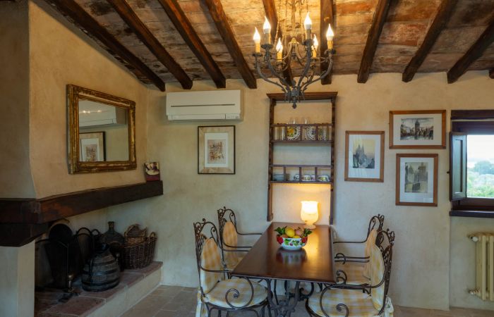 Small, intimate dining space warmed by a wood-burning fireplace.