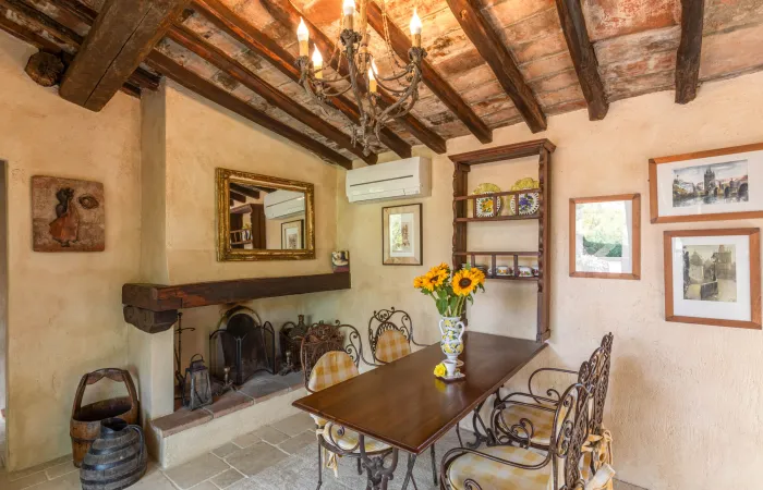 Small, intimate dining space warmed by a wood-burning fireplace.