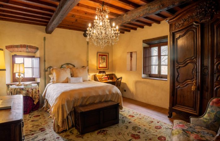 Guest Villa Suite with chandelier and antique décor.