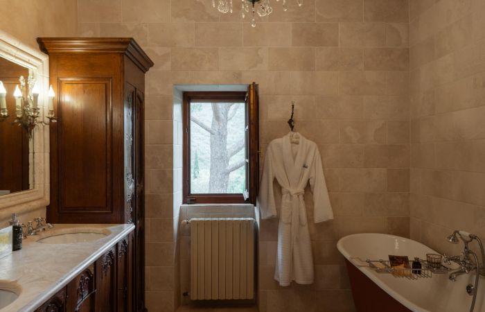 Master ensuite bathroom with claw-foot tub and steam shower.