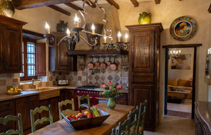 Farmhouse table carved from a centuries-old trunk, with seating for ten.