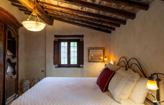 Guest House Queen Bedroom with garden views.